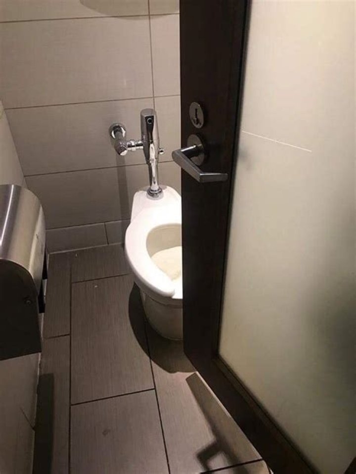 Why Do Bathroom Stall Doors Open Inward